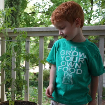 "grow your own food" tshirt on a young boy